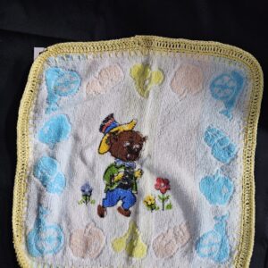 Toweling Washer with Pig and Flowers and Yellow Crochet Edge